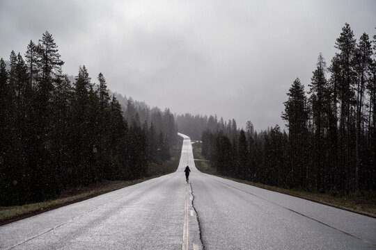 Woman running on snowy road
