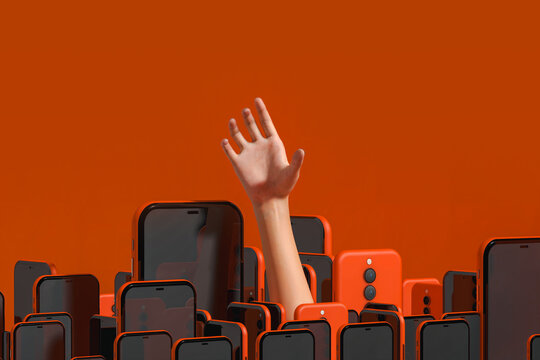 Hand emerging from a pile of smartphones