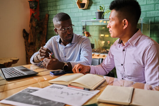 Young latin couple sharing ideas - Powered by Adobe