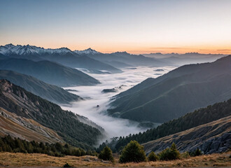 Scenic mountain landscape during sunrise with mist