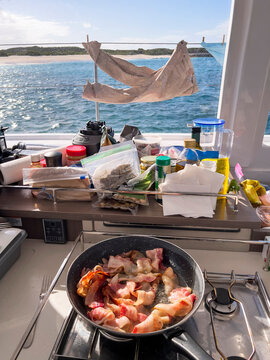 Morning on boat and bacon cooking breakfast and laundry drying 