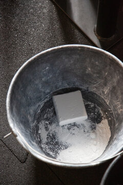 A bucket with chalk for the gym