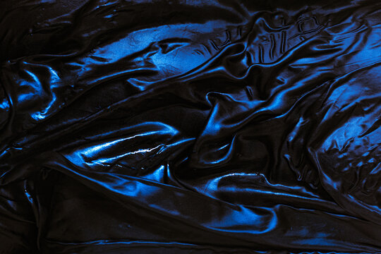 Sparkling Water Droplets on Dark Wet Body Fabric