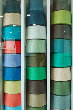display case of colourful thread