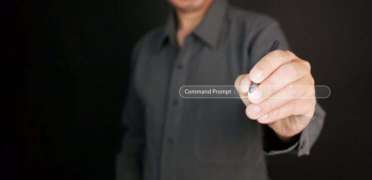 Command Prompt. A man with his stylus is writing or entering a prompt for AI, artificial intelligence, to generate something. Prompt engineering technology