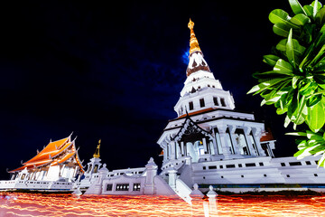 Candlelight around Pagoda Wat Pa Ban Tat temple Udon Thani, Thailand.