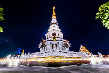 Candlelight around Pagoda Wat Pa Ban Tat temple Udon Thani, Thailand.