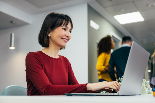 Professional woman working at her desk in office