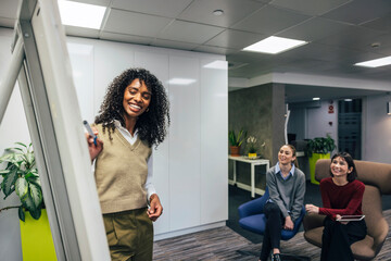 Friendly office environment with team discussion