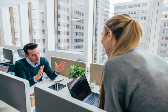 Modern office collaboration with cityscape backdrop