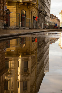 Part of street reflection in puddle. 