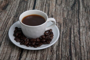 Little white Cup of black expresso coffee