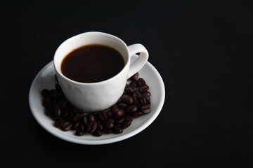 Little white Cup of black expresso coffee
