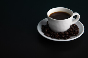 Little white Cup of black expresso coffee