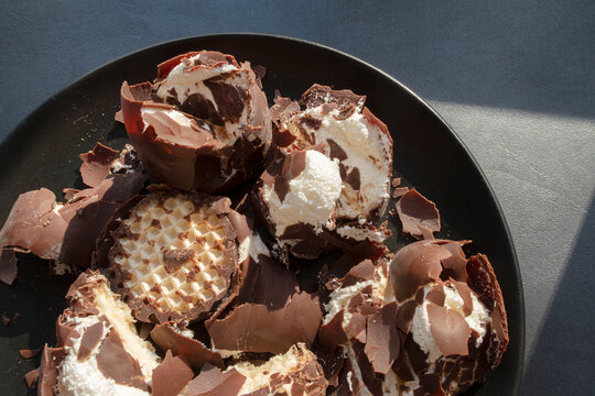 Messy chocolate, cream and cookie dessert on a plate