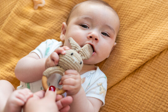 baby with teether 