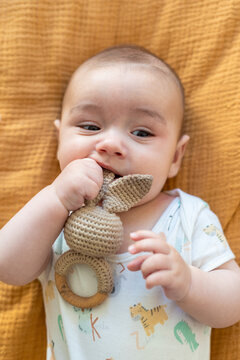 baby with teether 