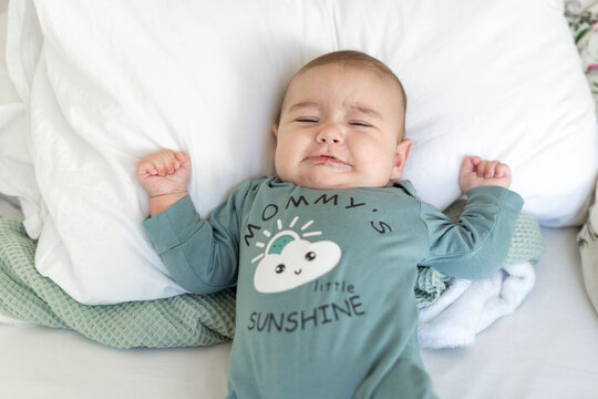 baby crying at bed 