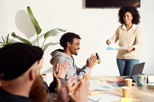 Celebratory Applause in a Collaborative Team Meeting