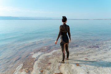 Serene Woman with Mud Mask at Lakeside