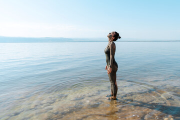 Serene Woman with Mud Mask at Lakeside