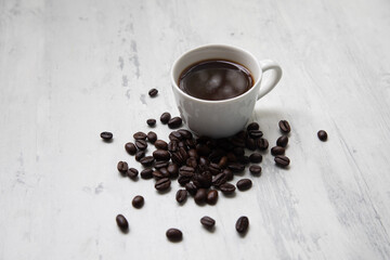 Little white Cup of black expresso coffee