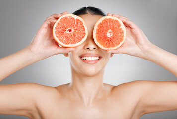 Studio, portrait or happy woman with grape fruit for detox, cleaning or healthy pores for beauty,...