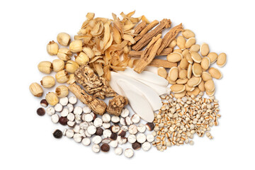 Group of Chinese dried herbs to make a healthy soup or bouillon isolated on white background