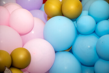 Photo zone with lots of yellow, blue, pink, purple balloons with golden color paper made...