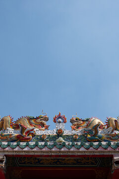 The roof of Chinese Temple under blue sky
