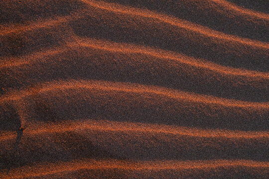 Texture of sand waves on beach.
