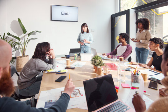 Interactive Team Meeting in Modern Office
