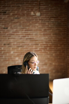 Multitasking Businesswoman on phone Call