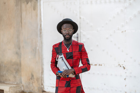 Stylish Man in Red and Black Suit and Hat