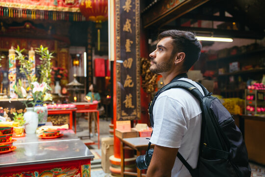 Man visiting an ancient Chinese Taoist temple