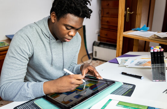 Focussed teen with digital technology