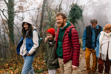 Tourists hike in woods