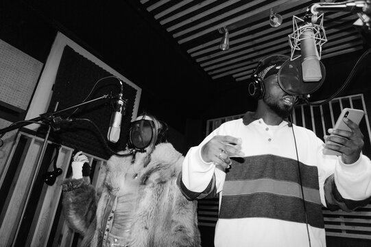 A man and a woman in a recording studio