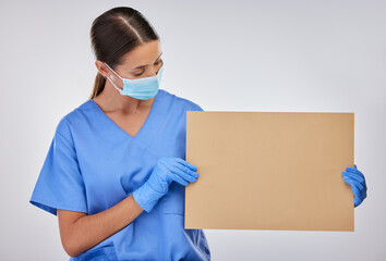 Reading, nurse and mask with poster for healthcare, advertising or mockup in studio. Female doctor,...