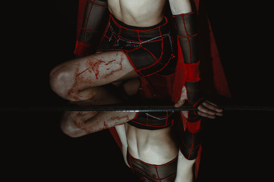 Close-Up of a Person with Fake Blood, Reflecting in Mirror