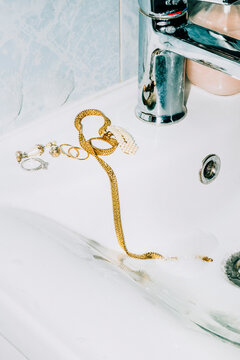 Jewellery on toilet sink