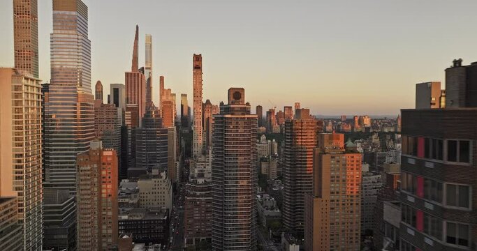 NYC New York Aerial v366 drone fly above 60th St capturing cityscape of Midtown Manhattan and Lenox Hill overlooking at Central Park at sunrise - Shot with Mavic 3 Pro Cine - September 2023