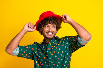 Photo of attractive elegant young man look empty space wear shirt isolated on yellow color background