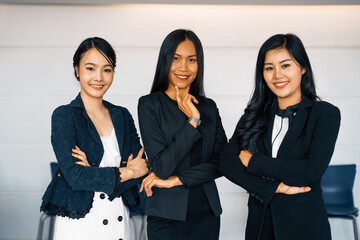 Young Asian businesswomen standing in office. Business friends and community concept. uds