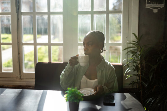 black woman in a cafe
