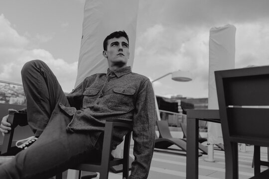 Portrait of a young guy in a gray shirt - Powered by Adobe