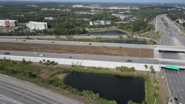 Aerial view of highway and ramp with traffic to an upscale mall located in Sarasota, Florida