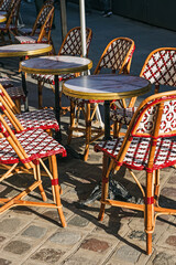 Traditional Parisian style chairs of the cozy street cafe, Paris, France
