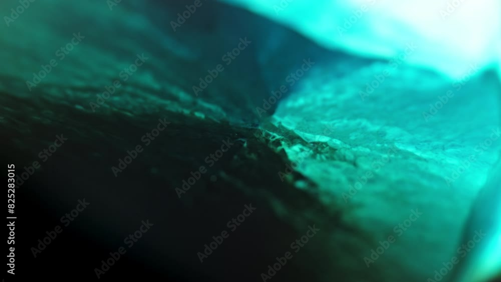 Poster abstract close-up of turquoise ink diffusing through water, creating vivid, organic patterns