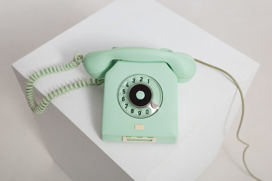 Closeup view at vintage mint colored rotary telephone
